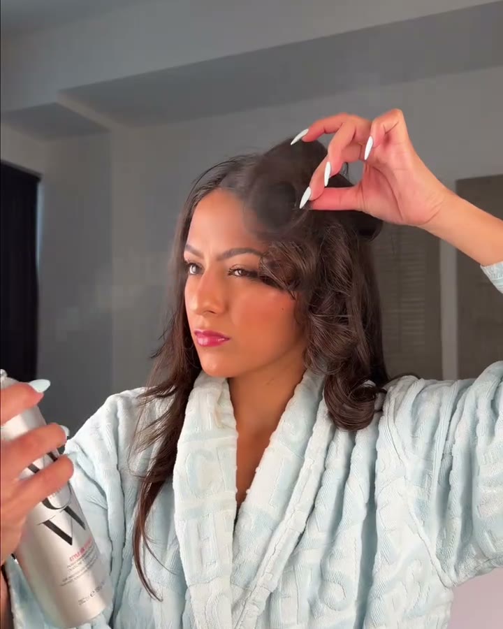 Roots first. Lift a section, spray underneath it, drop it (COLOR WOW Style on Steroids Texturizing Spray, Aerely Chacón)