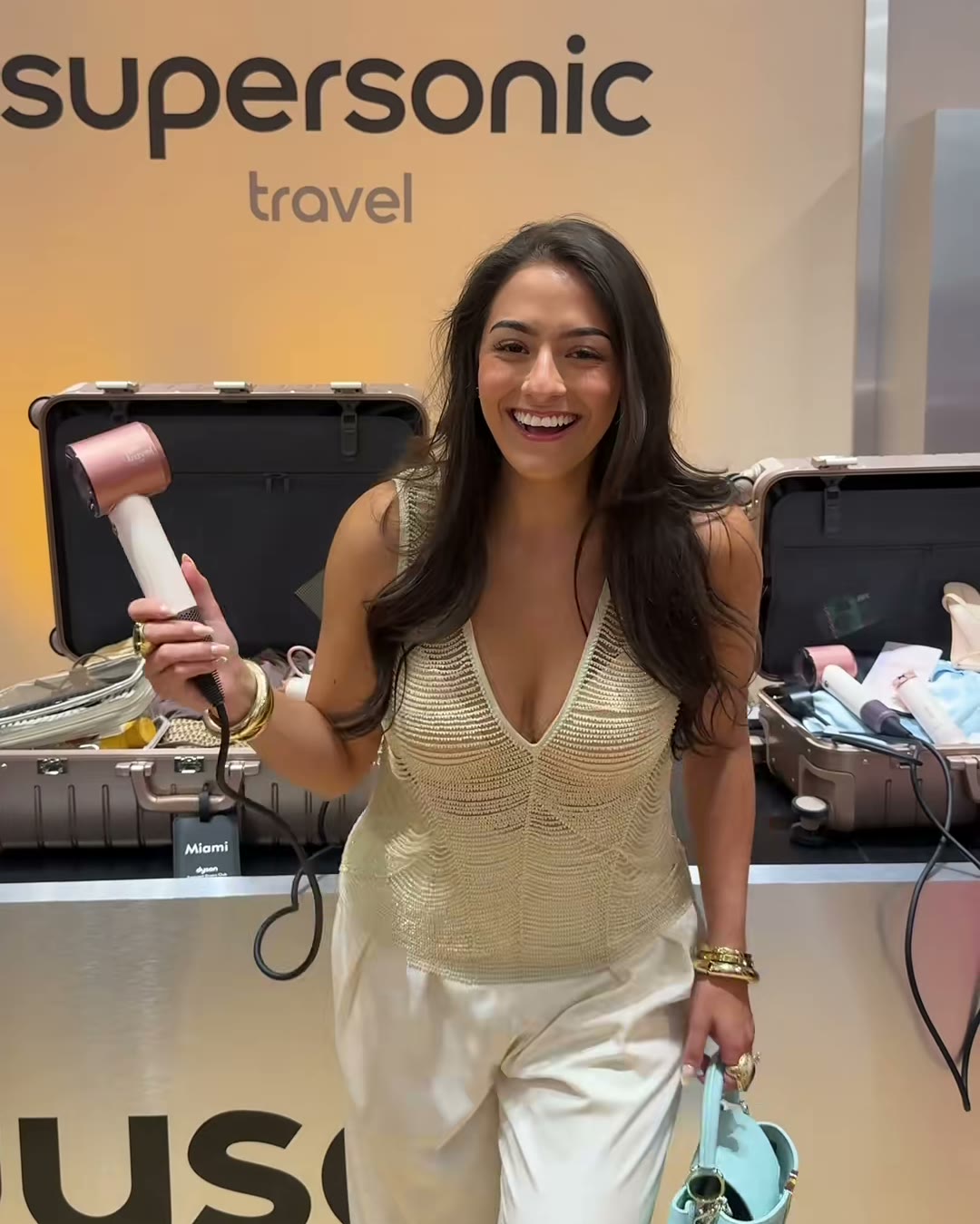 Me at the Miami launch, holding the Travel. Yes, I was this excited the (Dyson Supersonic Travel Hair Dryer, Aerely Chacón)