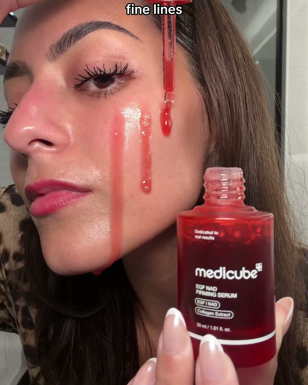 The red one. This is the EGF NAD+ Firming Serum, and it is the one I press (medicube EGF NAD+ Firming Serum, Aerely Chacón)