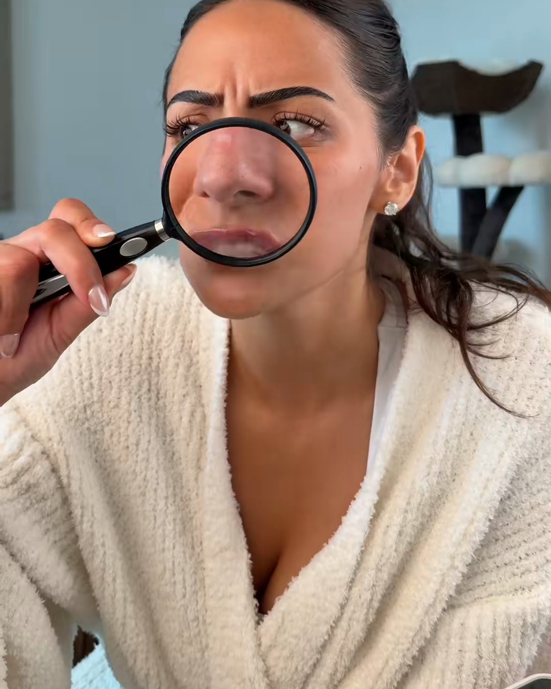 Me, a magnifying glass, and the strawberry nose I used to squeeze every (SKIN1004 Poremizing Clay Stick Mask, Aerely Chacón)